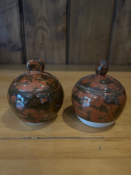 A Pair of Mottled Brown Lidded Jars